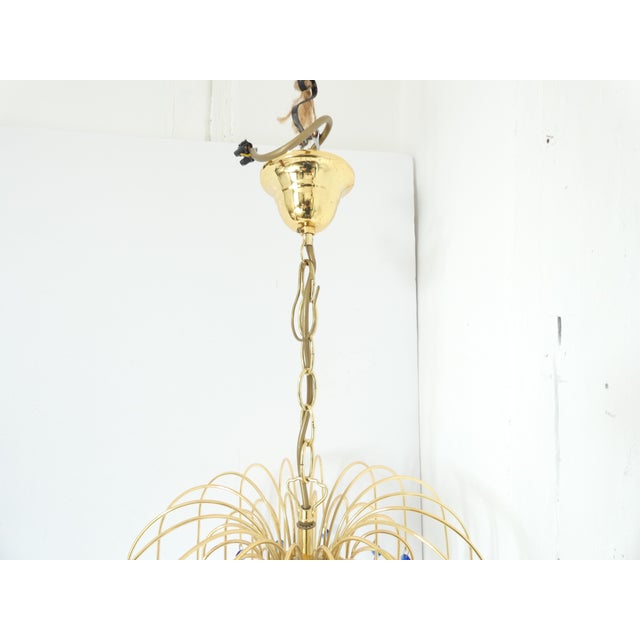 Mid-Century Murano Waterfall Chandelier in Brass and Glass, in Very Good conditions. Designed 1970 to 1979 European Plug...