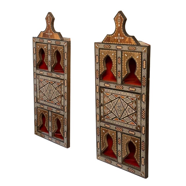 A rare and exquisite pair of marquetry wood inlays, masterfully crafted with natural mother of pearl. The intricate...