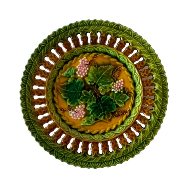 An antique, late 19th-century, c.1890, tin-glazed majolica 7.75" fruit plate by Villeroy & Boch, with a central relief of...