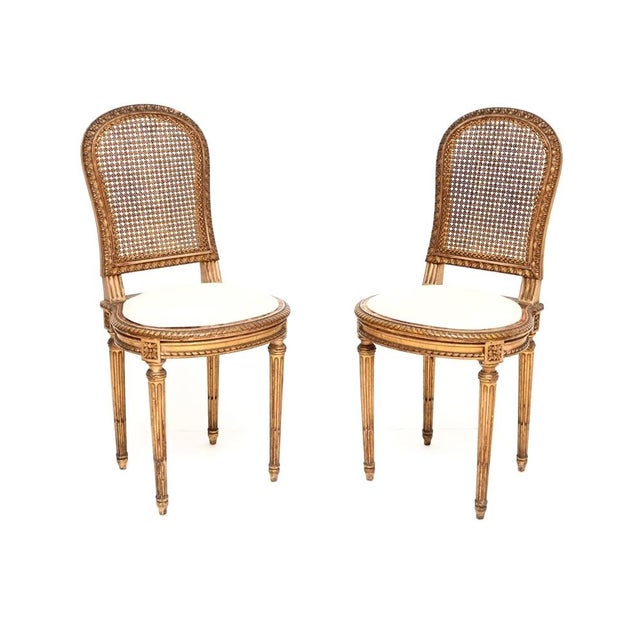 An outstanding pair of antique French gilt wood side chairs, dating from around the 1890-1910 period. They are of superb...