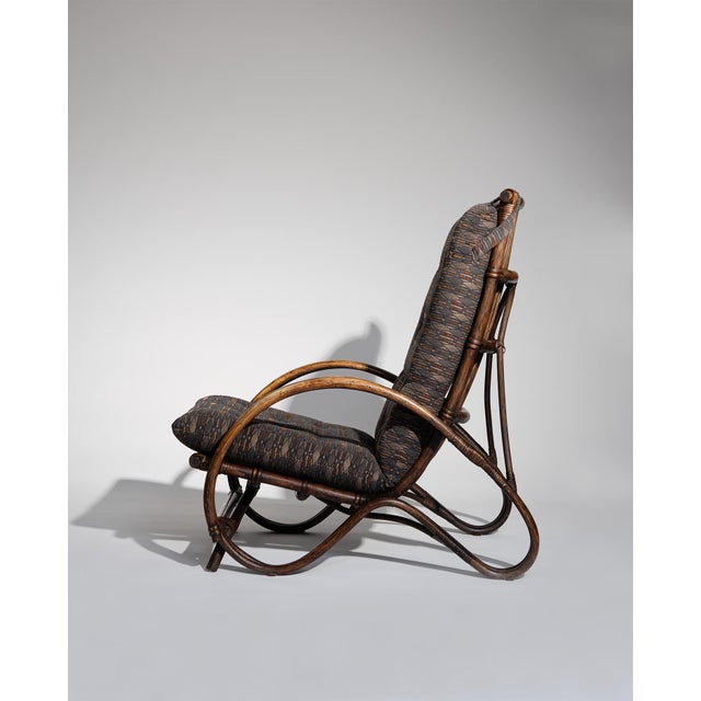 Set of two dutch production rattan armchairs from the 1960s, featuring an organic sculptural form with artisanal...
