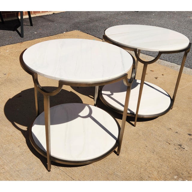 2 matching circular side tables from Bernhardt. Line is called "Morello". Each side table contains faux Carrara Marble...