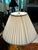 Offering two table lamps with pleated shades. Urn shaped crystal with brass trim. Excellent condition.
