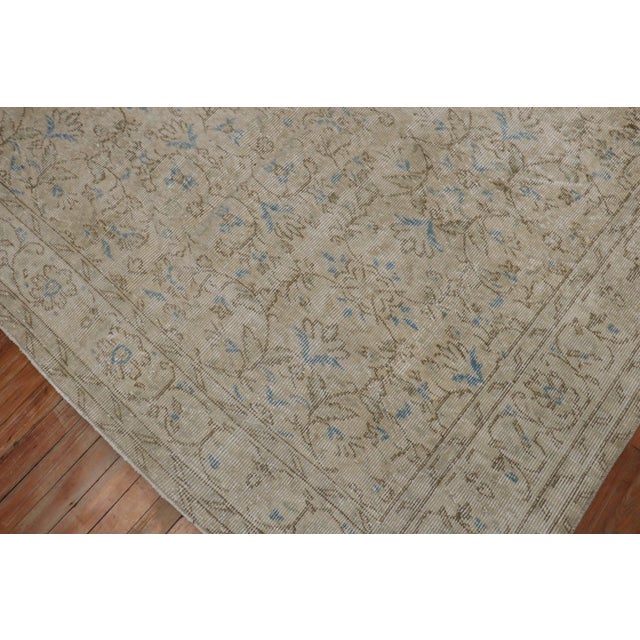 A mid 20th century evenly worn turkish rug in neutral colors..Professionally Cleaned and able to endure heavy traffic if...