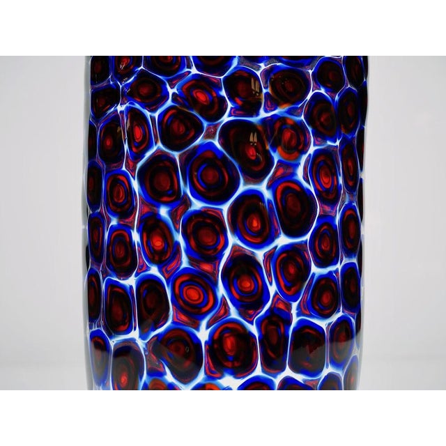 Splendid vase with circular handmade murrinas blue and red. The Murriina is made by casing clear, cobalt, red, Cobalt and...