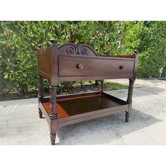 Vintage Ralph Lauren mahogany two-tier server featuring a shaped gallery back with carved scroll detailing, a full-width...