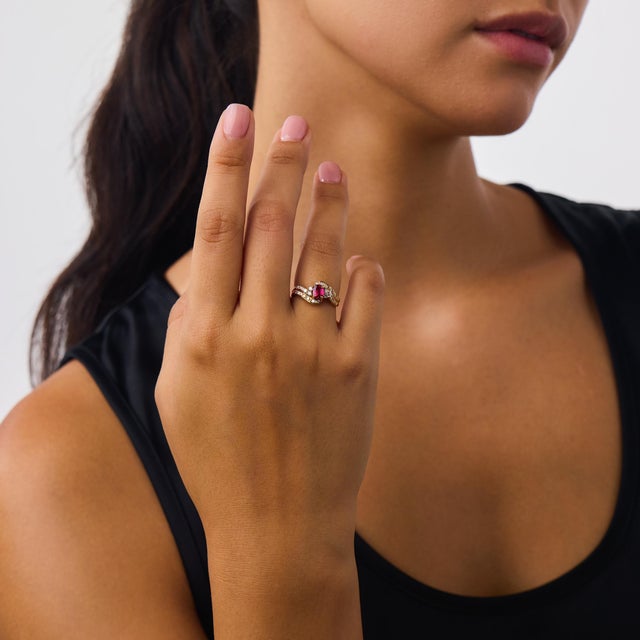 This beautiful vintage ruby and diamond swirl ring is a charming 1980’s design, centered by a cushion brilliant cut ruby...