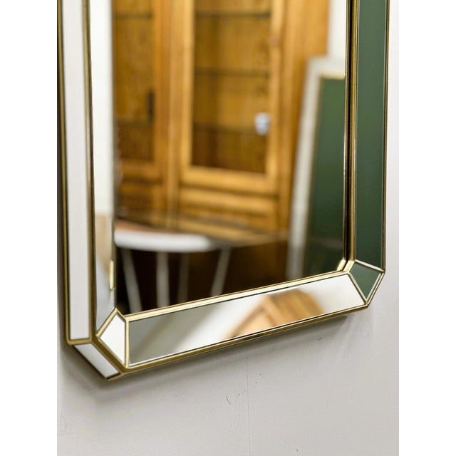 Elegant rectangular wall mirror designed by De Knudt, Belgium, circa 1980s.This beautifully crafted piece features a deep...