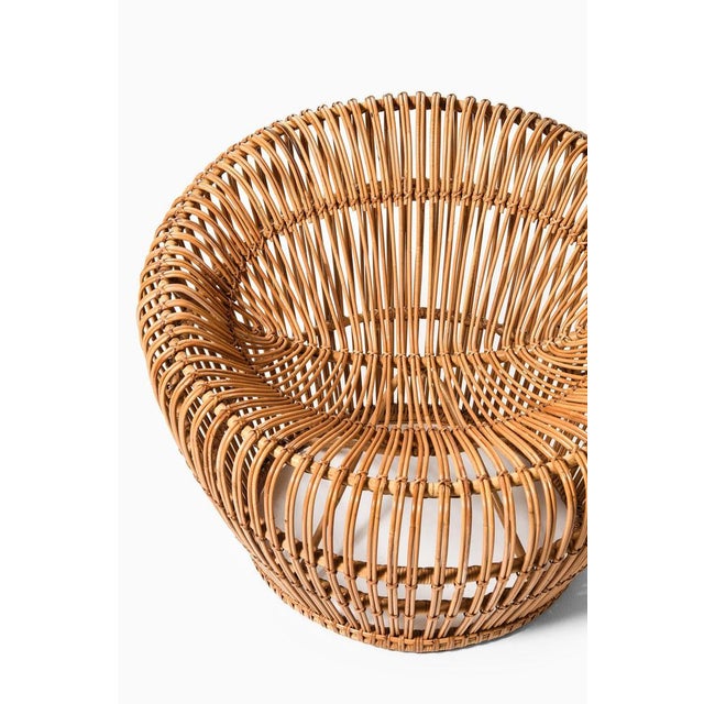 This rare easy chair, designed by franco albini and produced in italy during the 1950s, is a significant example of mid-...