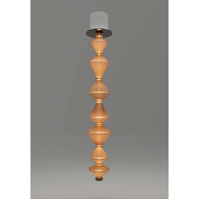 Atelier oï oïphorique t gr suspension lamp for parachilna oïphorique displays an elegant textile diffuser. After turning...