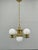 Exceptional Art Deco chandelier produced in Czechoslovakia during the 1930s. This elegant four-light fixture embodies the...