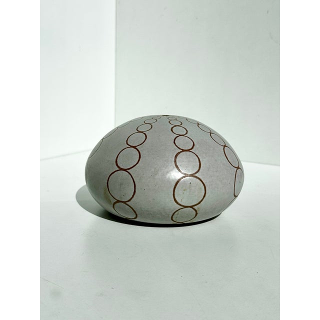 Handcrafted studio ceramic vase in the form of an abstract fossilized sea urchin, likely made in Germany in the 1980s. The...