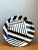 Defined by dynamic optical contrast and bold graphic angles, this vintage large round decorative tray features an eye-...