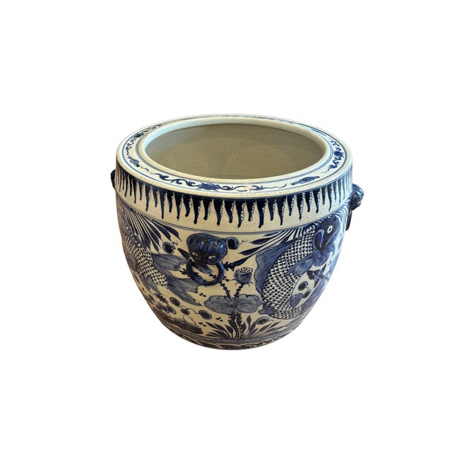 This fish motif planter is an artisan-crafted porcelain container designed to bring timeless grandeur to you home. Hand...