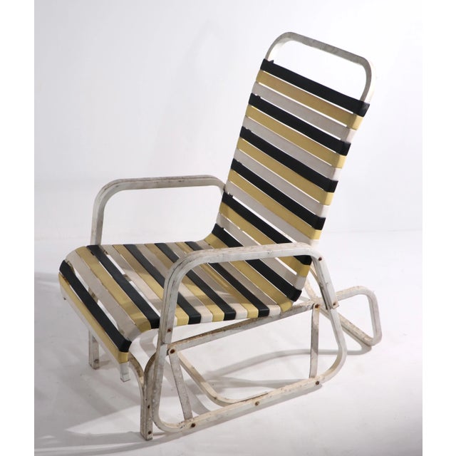 Interesting glider style lounge chair, in the style of Brown Jordan circa 1970's. The base has a stationary bottom,...