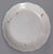 A wonderful 18th century Nevers polychrome plate feauturing a bird perched on top of of a spray of flowers emerging from a...