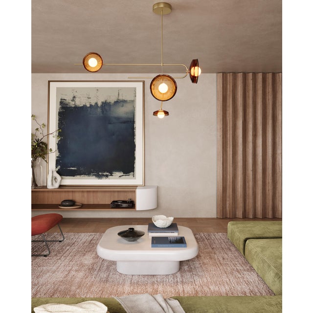 This pendant light focuses on the balance between weight and transparency. Defined by brass rod framework, the design...