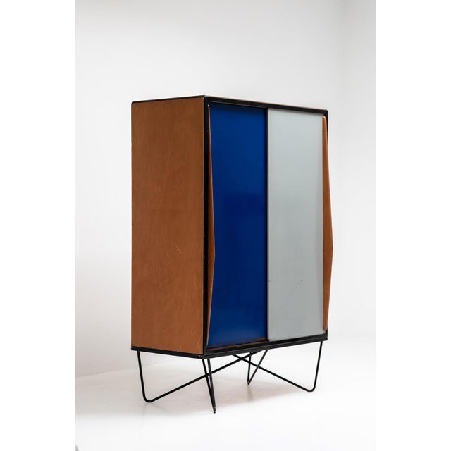 Most rare version of this cabinet, with the cross legged base. This piece is attributed to the mentioned designer/maker....