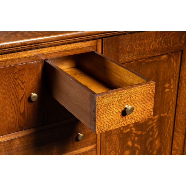 c. early 1900s; Aurora Furniture Co. - Aurora, IN Quarter sawn oak gentleman's wardrobe featuring a bank of five graduated...