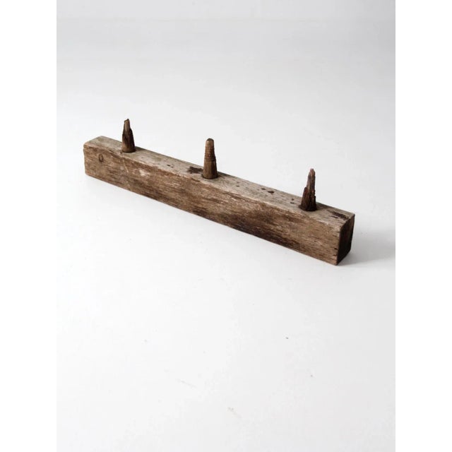This antique American rustic post is designed for use as a mounted rack and offers both functional utility and decorative...