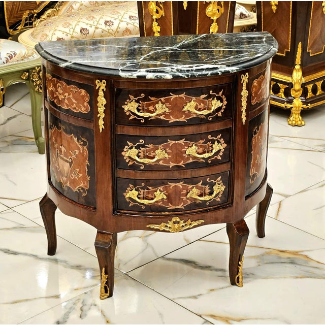Bring timeless French elegance into your home with this exquisite Louis XV bombe chest, beautifully crafted from fine wood...