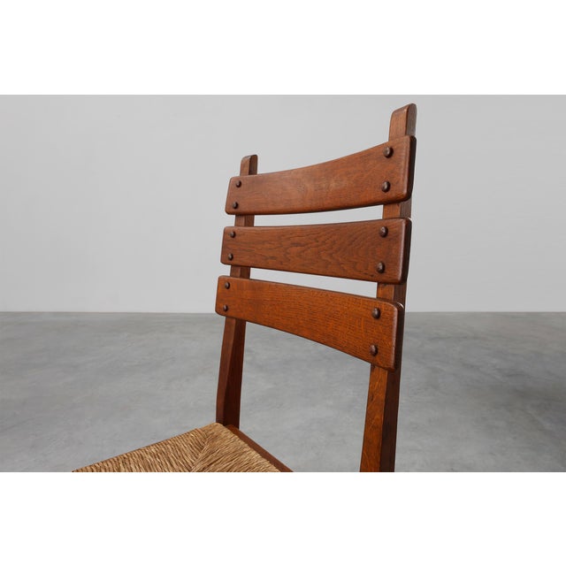 Belgium / 1960 / Chair / oak and wicker / Brutalist / Mid-century This distinctive chair from Belgium, crafted in the...