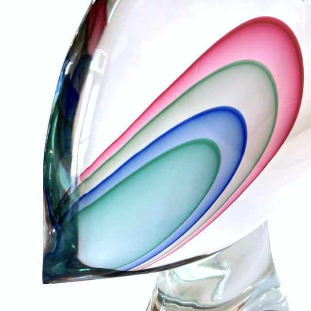 Signed L. Onesto Murano glass fish. Made with the "Sommerso" technique with layers of glass and contrasting colors. Raised...
