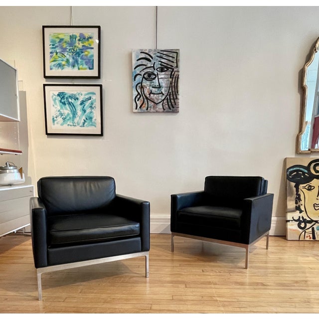 Pair of stunning black leather Nicos Zogrophos club chairs. Nicos Zographos made his name during his time at the renown...