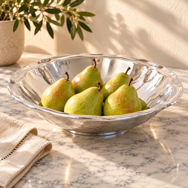 A substantial early-2000s centerpiece and serving bowl by Five Elm, handcrafted in Mexico from cast aluminum. The broad,...