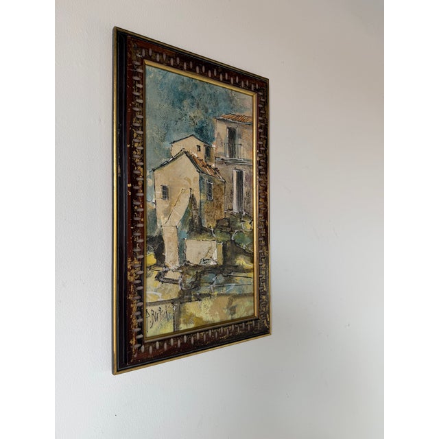 Vintage European Landscape Oil On Canvas Painting featuring a charming old-world village scene with textured architectural...