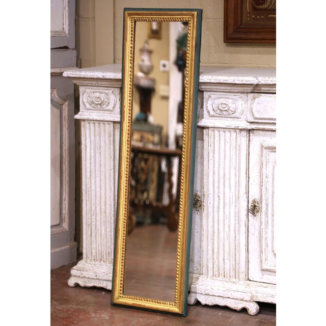 This antique French wall mirror was crafted circa 1870 in the Louis XVI style and features a refined combination of...