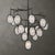 The Maxin, 15 Lt Large Chandelier Rings of dark hammered bronze with a subtle golden interior. Inspired from mid-century...