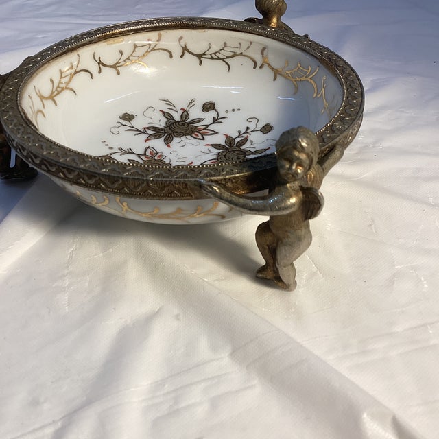 This piece is from the TAJ importing Co ,San Francisco . Japan Candy Dish with Cherubs for a Stand. Measures about 5”x 2"...