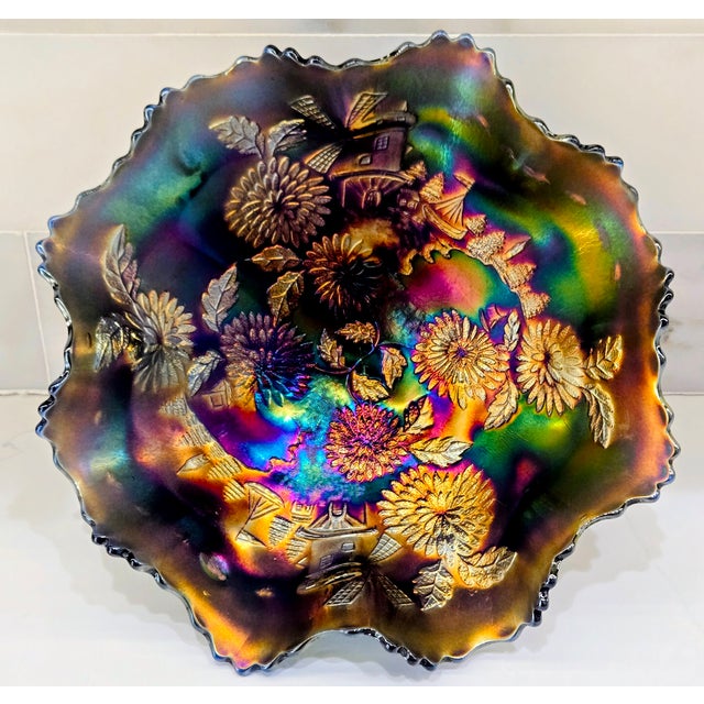 Iridescent classic‑period carnival glass bowl in the Windmill pattern, attributed to Imperial Glass. Rich amethyst glass...