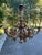 French Baroque carved giltwood chandelier. Large ornate 6 arm lights with additional light underneath the bottom of the...