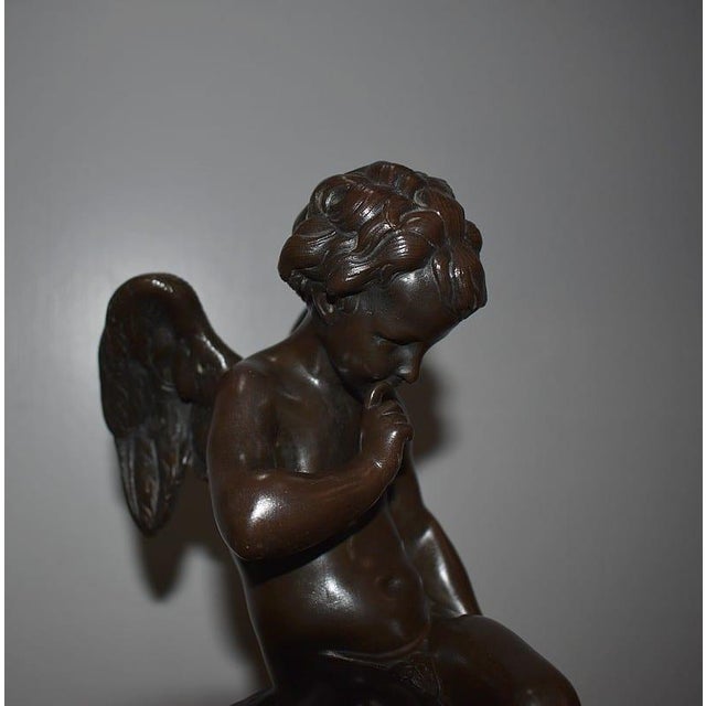 Bronze with brown patina "Amour pensif" after Etienne-Maurice FALCONNET (1716-1791), a famous work commissioned by Madame...