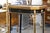 An elegant English Chinoiserie ebonized side table, combining refined craftsmanship with timeless Asian-inspired...