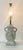Glazed ceramic antique white urn style lamp. Shows white glaze over caramel undertones on the body and caramel over white...