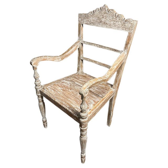 This beautiful Raffles influence chair is hand-carved from reclaimed teak wood. We found an antique chair and reproduced...