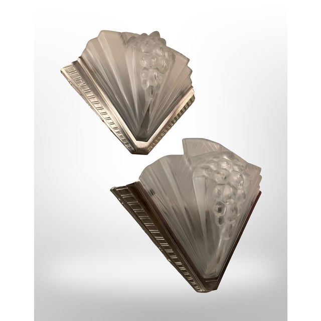 Exceptional and important pair of art deco wall sconces signed petitot france circa 1930 (paris, france) large pressed...