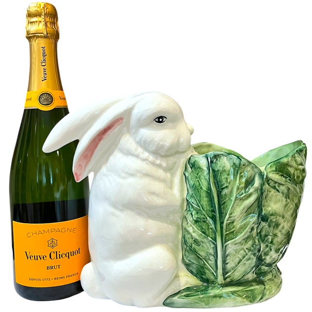 A wonderfully whimsical vintage Italian majolica cachepot, modeled as a large white rabbit nestled beside a beautifully...
