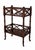 A classic two-tier side table in a rich Plantation Cherry finish, featuring elegant crisscross fretwork and turned legs...