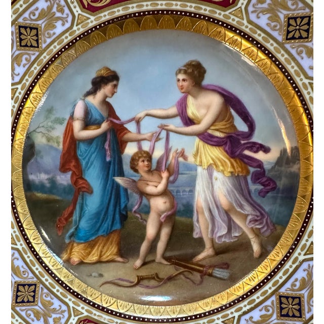 This 19th century, hand-painted Royal Vienna plate depicts an allegorical scene with the requisite classically dressed...