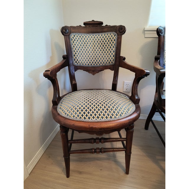2 Chairs with arms. 6 side chairs. Padded seats and back. Renaissance revival style. Circa 1875.
