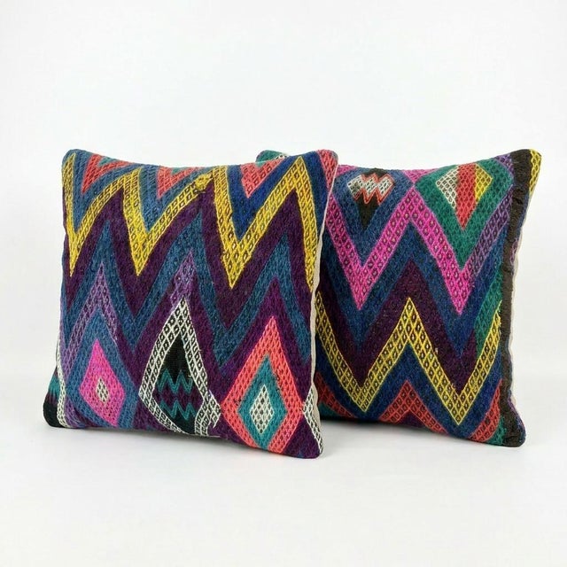This beautiful 24'' x 24'' pillow cover set was made from authentic Turkish rug pieces. Bright colors of wool adorn the...