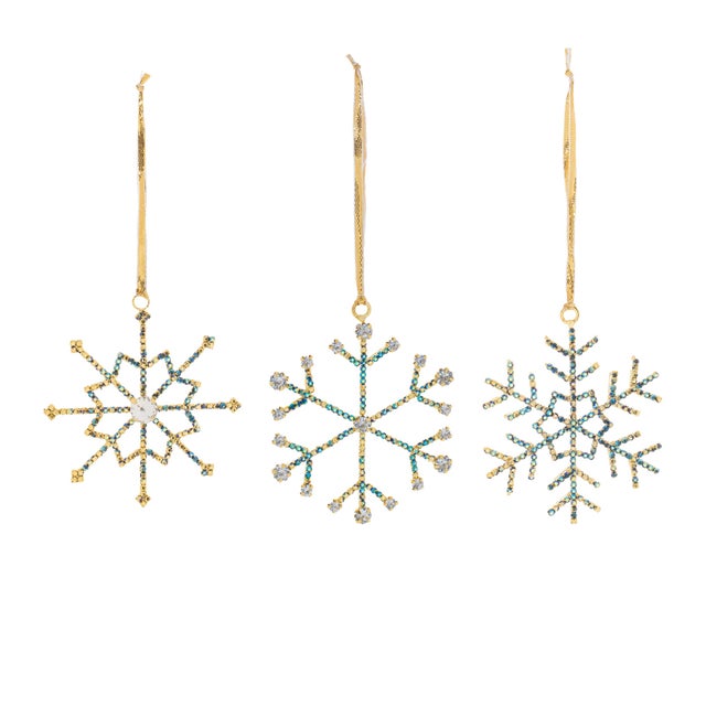 Bring a touch of sophistication to your holiday decor with the Jeweled Metal Snowflake Ornament. Featuring wintry blue and...