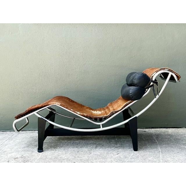 This iconic LC4 Chaise Lounge, designed in the spirit of Le Corbusier, Charlotte Perriand, and Pierre Jeanneret, remains a...