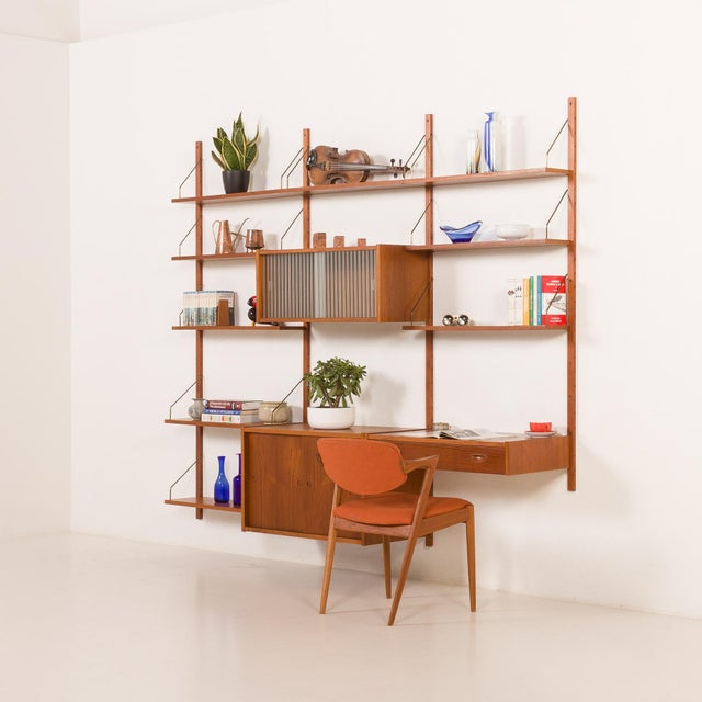 This elegant danish shelving wall unit was designed by preben sørensen and manufactured by ps system in randers in the...