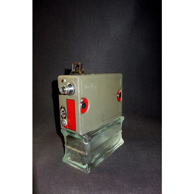 Submitted for your consideration is this Circa 1931 16mm DeVry hand crank spring wound motion picture camera. Includes...