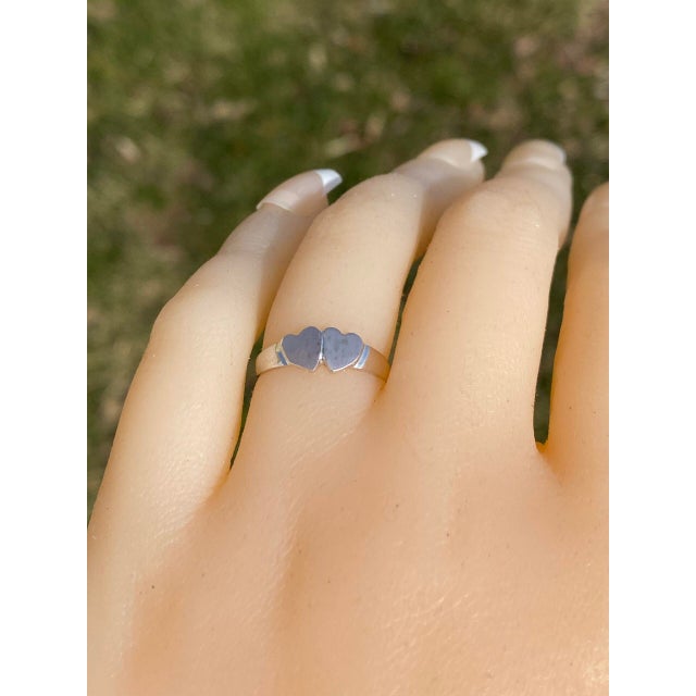 The Oscali: Double Heart Signet Ring in White Gold. This elegant ring features a "Toi et Moi" double lovers' heart at the...